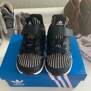 Adidas black with gold stripes